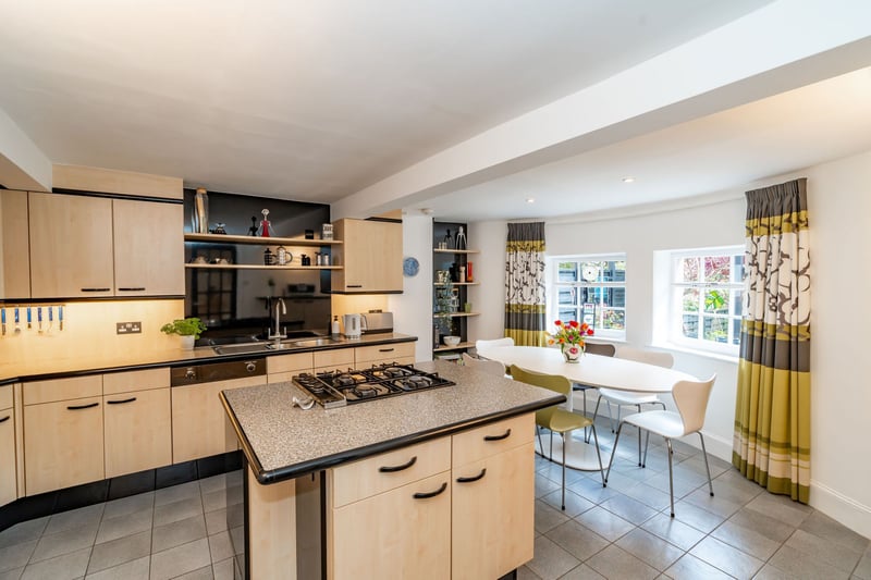 Downstairs, there is a large open plan kitchen and dining room which looks out onto the lovely gardens. All appliances are integrated and include a gas hob, fridge, freezer, dishwasher, oven and grill.