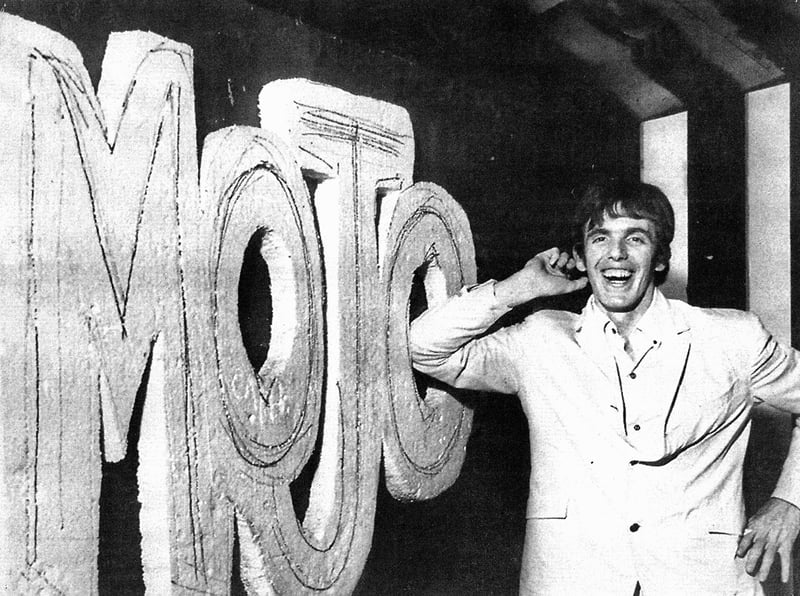 Peter Stringfellow with the King Mojo club sign