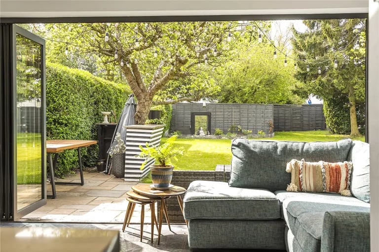 In the warmer months, the room connects seamlessly with the patio.