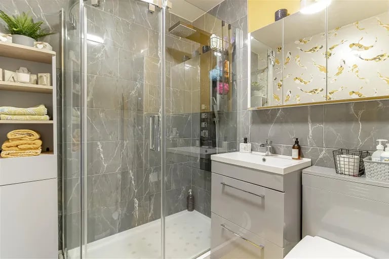 The house bathroom has a large shower cubicle.