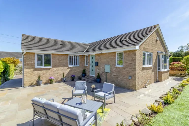Enter the newly refurbished home via this large patio to the rear.