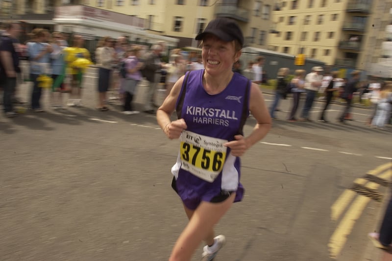 Kirkstall Harriers runner Julie Hostwit passes Ocean Terminal during the 2004 Edinburgh Marathon.