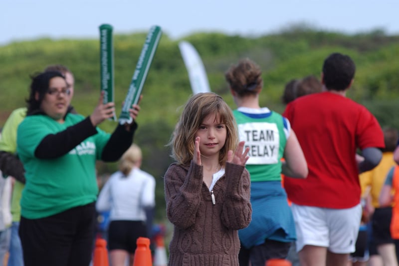 Eight-year-old Emily Nicholson from Limekilns in Fife waits for her mum who was running the 2008 Edinburgh Marathon,  and cheers the other runners on.