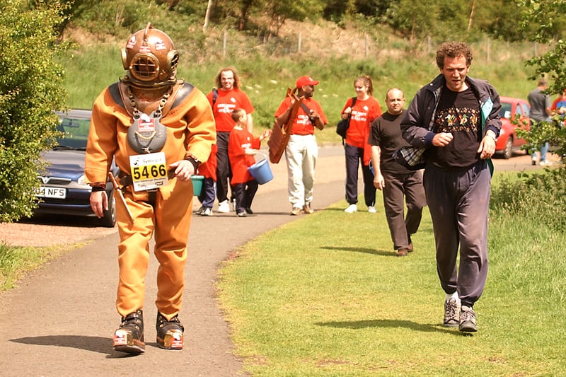 This runner, Lloyd Scott, must have bet someone a fiver that he could complete the Edinburgh Marathon in 2003 while wearing a 130lb deep sea diving suit. Lloyd recorded the slowest every marathon time, starting his slow walk six days early so he finish on the same day as everyone else. He is pictured above making his way, slowly, through Holyrood Park.