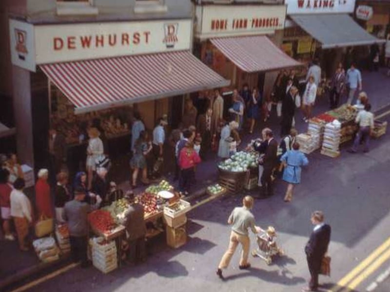 Dixon Lane, Sheffield, some time between 1960 and 1979, showingJ. H. Dewhurst butchers Home Farm Products pork butchers, and William John King provision dealers