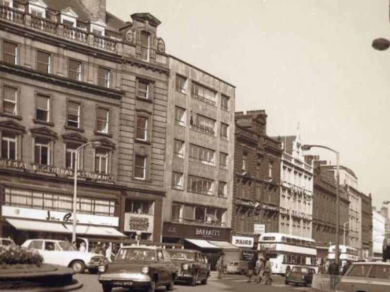 Fargate, Sheffield city centre, some time between 1960 and 1979, showing Joan Barrie, ladies fashions; Burnley Building Society; Barratts, shoe dealers; and Paige, gowns