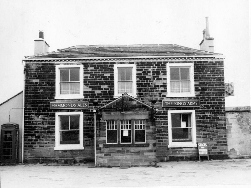 the King's Arms public house at number 2 Street Lane. Signs outside advertise Hammonds Fine Ales and a board offers snacks and morning coffee. This public house has now been demolished because of road improvements in the area. Pictured in March 1967.