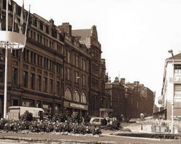 Leopold Street, Sheffield city centre, seen from Fargate, some time between 1960 and 1979, showing the Goodwin Fountain, Wilson Peck music warehouse, Marshall and Snelgrove fashion shop, the Grand Hotel and Education Department offices