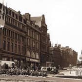 Leopold Street, Sheffield city centre, seen from Fargate, some time between 1960 and 1979, showing the Goodwin Fountain, Wilson Peck music warehouse, Marshall and Snelgrove fashion shop, the Grand Hotel and Education Department offices
