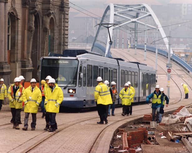 Supertram makes its first entry into the city centre arriving on a proving journey over the new bow string bridge into Commercial Street, 5th November 1993