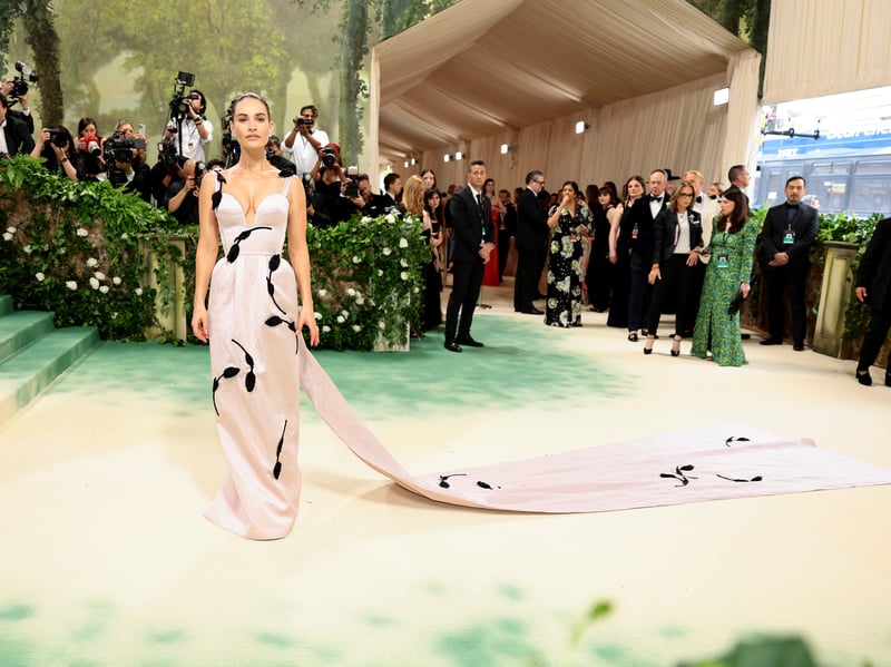 Lily James attends The 2024 Met Gala Celebrating "Sleeping Beauties: Reawakening Fashion".