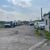 A police dog has also been pictured at the scene, amid at least six emergency vehicles which are parked at the Bruce Dyer Love Life Sports Ground, up the road from the address.