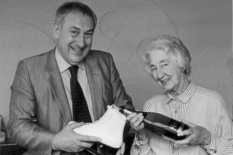 Doris Thompson Chairman of Blackpool Pleasure Beach,pours a celebration boot of champagne for the Ice Drome Manager Tony Scott