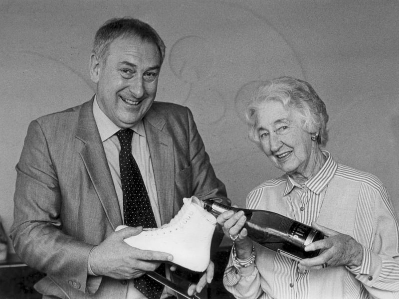 Doris Thompson Chairman of Blackpool Pleasure Beach,pours a celebration boot of champagne for the Ice Drome Manager Tony Scott