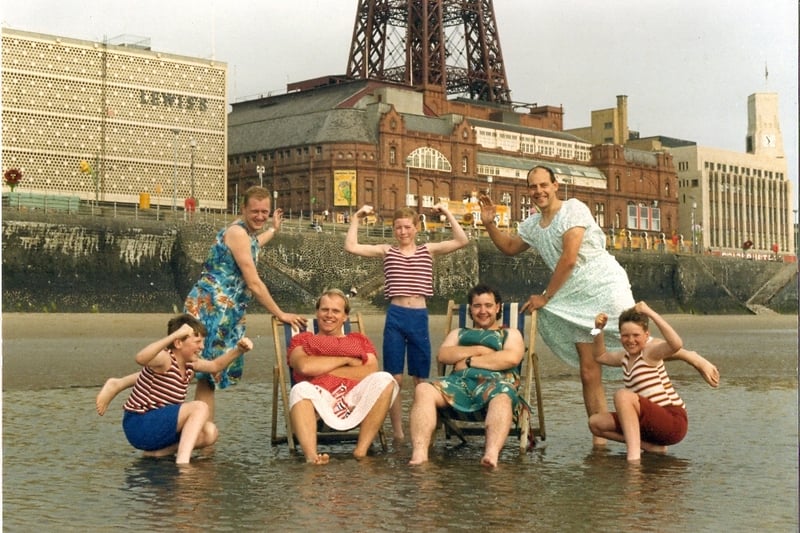 On the beach in 1988, three young members of The Gang Show cast pose with (back left) Mark Wilson, (front left) Keith Winters, (front right) Peter Burgeen and (back right) Dave Swift.