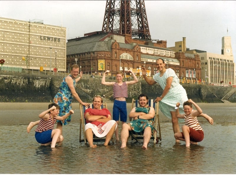 On the beach in 1988, three young members of The Gang Show cast pose with (back left) Mark Wilson, (front left) Keith Winters, (front right) Peter Burgeen and (back right) Dave Swift.