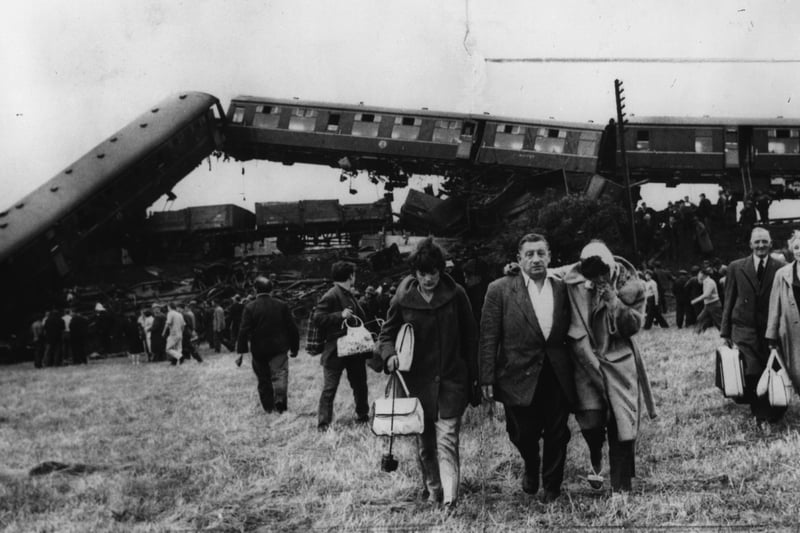 16th July 1961:  Survivors stumble away from the wreckage of the crashed Blackpool holiday train. Six people were killed and 120 injured