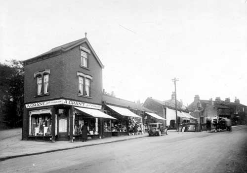 A view of North Lane from the junction with South Parade and Kirkstall Lane. Number 62, premises of Alex Grant, draper. Moving right, number 60 Thomas Benson dairyman, then 58 was Murphys hardware shop. Next at 56, Misses Edith and Frances Needham, newsagents. The two shops to the right were number 54 Public Benefit Boot Co. and 54 was also the Thrift grocers store. Pictured in October 1931.