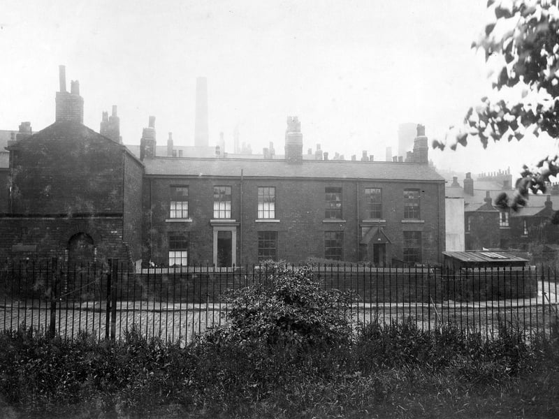 A row of houses on the far side of St James Square in July 1930. Note underneath photographs says 'site for municipal offices'. This became the civic hall complex.