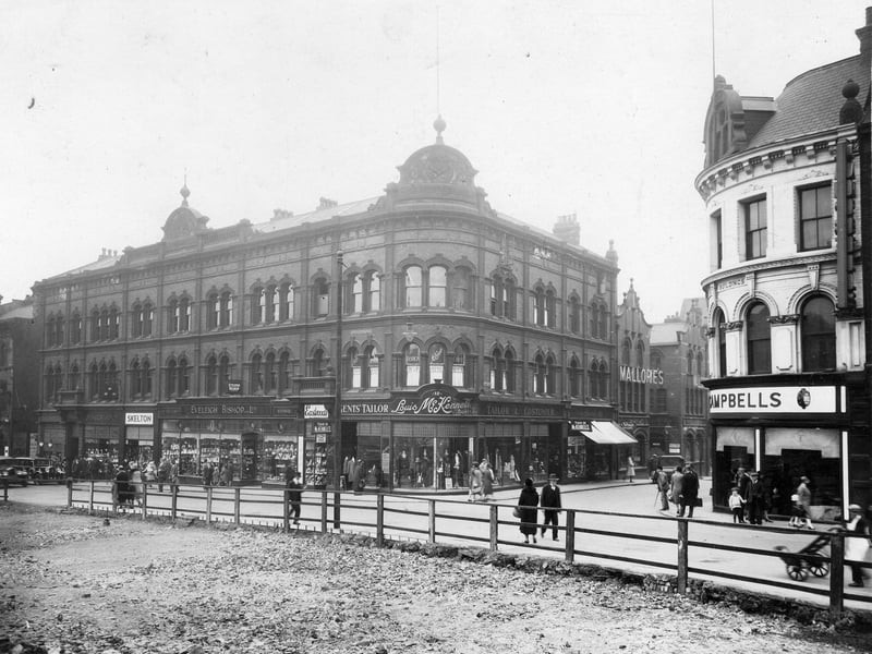 The Headrow in June 1930. To the left, is Owen and Robinson, pawn brokers and fancy goods - three balls sign can be seen above shop. Next is Edward Skelton hosiery. Then Bishop Eveleigh (Leeds) Ltd, silversmiths and George Eastwood tobacconist. At the junction with Lands Lane, Louis McKennell, tailor and valet service. Visible down Lands Lane is Mallories - wine and spirit merchants. All the cleared site in the fore front is for the new Lewis's store
