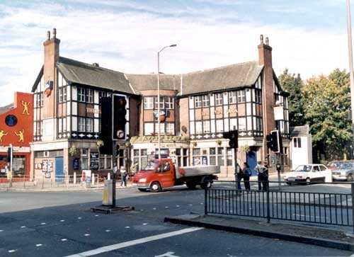 Hyde Park Public House at Hyde Park Corner pictured in October 1999. This photo is looking from Woodhouse Lane with Woodhouse Street on the right. Headingley Lane just visible with Headingley Estates, estate agents on corner.