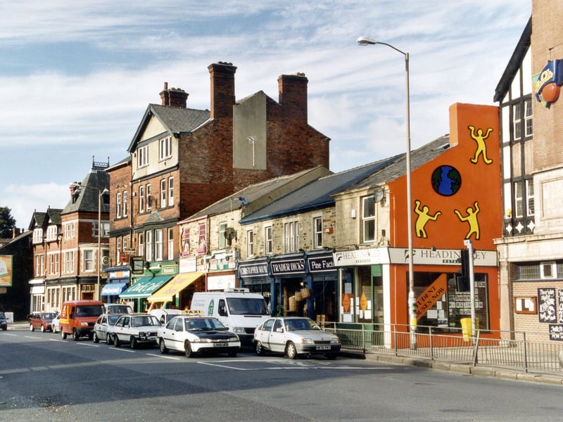 Businesses on Headingley Lane. Headingley Estates, Estate Agents can be seen on the right at number 2 Headingley Lane. Hyde Park public house is just visible. Pictured in October 1999.