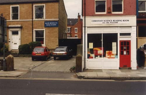 Properties on the east side of Headingley Lane. Halton, Benson and Co., Chartered Accountants are to the left at no. 32. The Christian Science Reading Room is at no. 30, to the right. Pictured in May 1994.