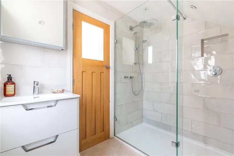 Here is also a shower room with large walk-in shower.