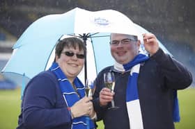 Andrew Perkins, aged 25, of Sheffield, celebrates at Hillsborough stadium after winning £1,150,000 in the EuroMillions Mega draw on Friday March 27, 2015. He is pictured with girlfriend Christina Maher