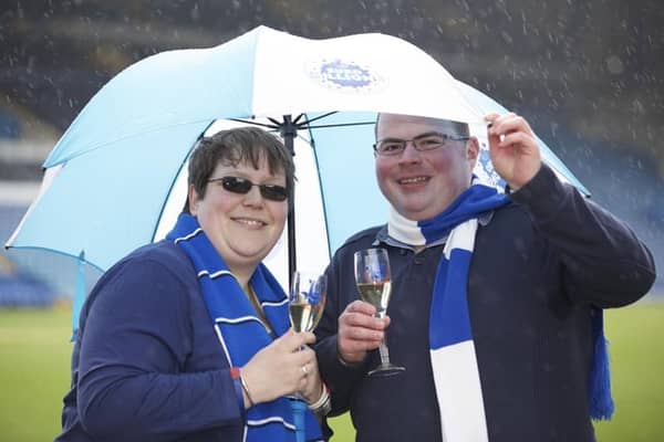 Andrew Perkins, aged 25, of Sheffield, celebrates at Hillsborough stadium after winning £1,150,000 in the EuroMillions Mega draw on Friday March 27, 2015. He is pictured with girlfriend Christina Maher