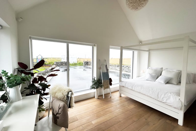 Boasting an angelic white bedroom, Achnagairn House is a characterful new-build home all on one level.