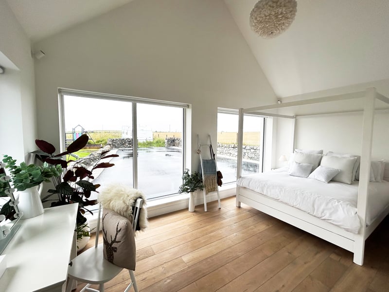 Boasting an angelic white bedroom, Achnagairn House is a characterful new-build home all on one level.