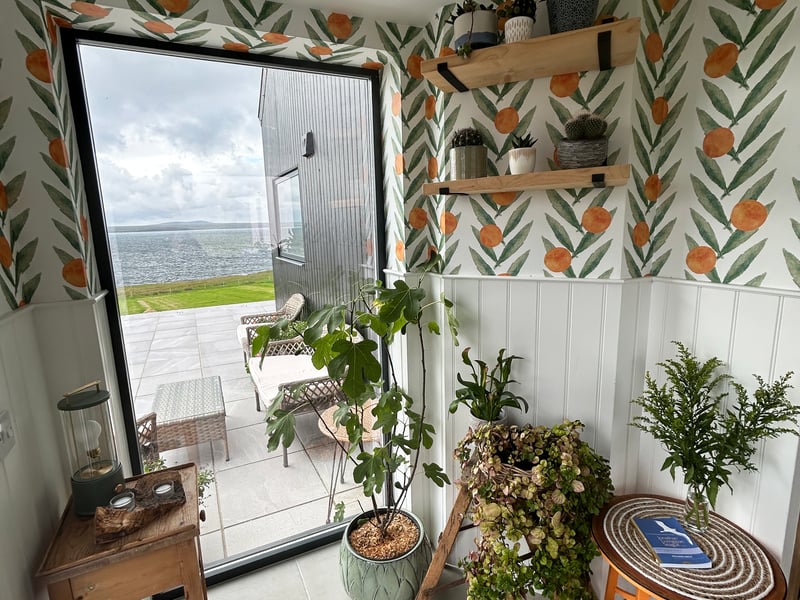 Tall windows perfectly frame the coastal views.