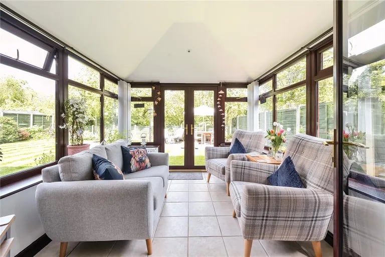 It has access to the stylish conservatory overlooking the rear garden.