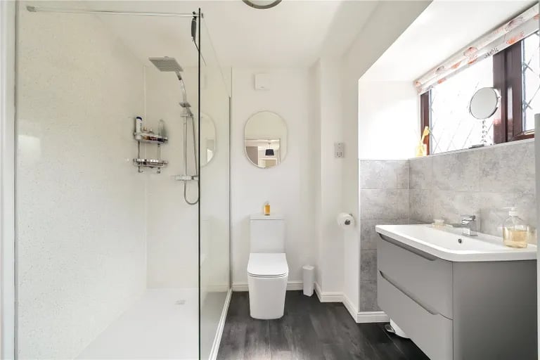 The house bathroom has a large walk-in shower.