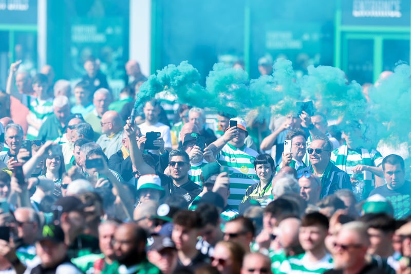 Celtic fans show their support by letting off green flares as the team bus arrives at Celtic Park around 90 minutes before kick-off. 