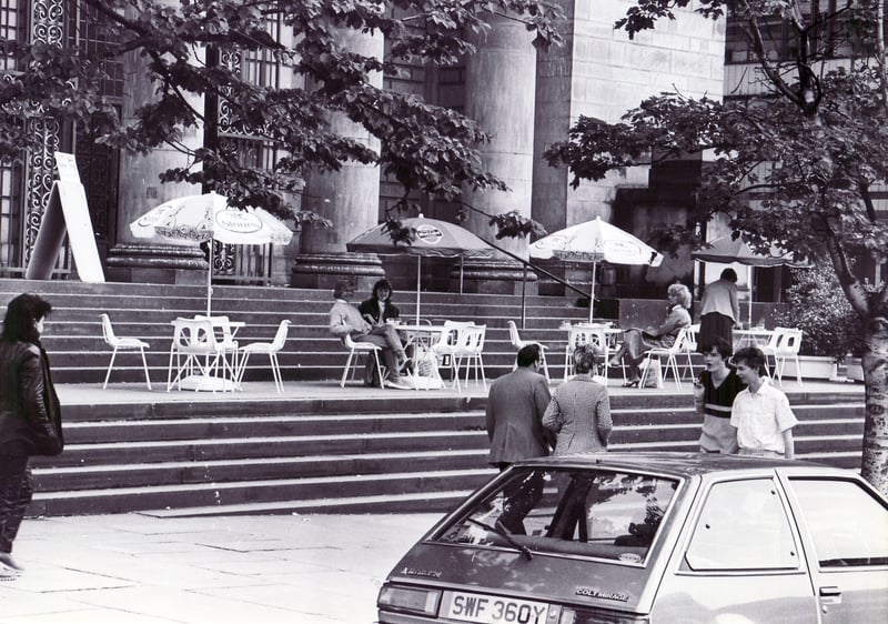 The scene in Barker's Pool in June 1985 is reminiscent of Paris, with colourful parasols over the tables, as shoppers enjoy a cuppa outside Sheffield City Hall