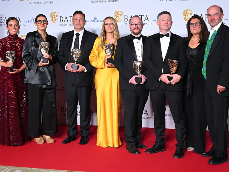 Tim Harcourt (sixth right), Stephen Lambert (eighth right) and the production crew of 'Squid Game: The Challenge' pose with the Reality Award in the Winners Room during the 2024 BAFTA Television Awards.