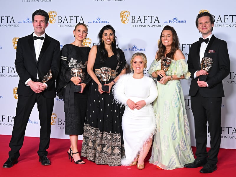 Nick Underhill, Kathryn Jein, Jasleen Sethi, Ellie Simmonds, Colleen Flynn and David Thompson pose with the Single Documentary Award for 'Ellie Simmonds: Finding my Secret Family' in the Winner's Room during the 2024 BAFTA Television Awards.