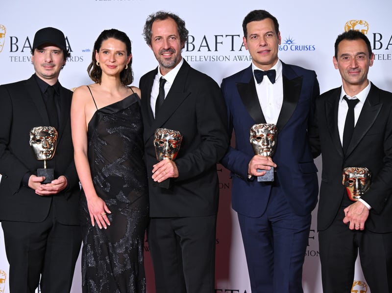 Olivier Demangel, Josaphine Japy, Tristan Saguela, Laurent Lafitte and Bruno Nahon pose with the International Award for 'Class Act' in the Winners Room during the 2024 BAFTA Television Awards. 