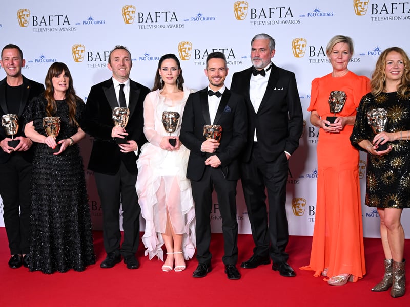 Scott Mills, Suzy Lamb, Julia Sanina, Lee Smithurst, Nikki Parsons and the production crew pose with the Live Event Coverage Award for 'Eurovision Song Contest 2023' in the Winners Room during the 2024 BAFTA Television Awards.