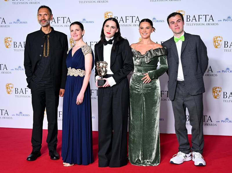 Paul Bazely, Louise Brealey, Kat Sadler, Lizzie Davidson and Freddie Meredith pose with the Award for Scripted Comedy for 'Such Brave Girls' in the Winners Room during the 2024 BAFTA Television Awards.