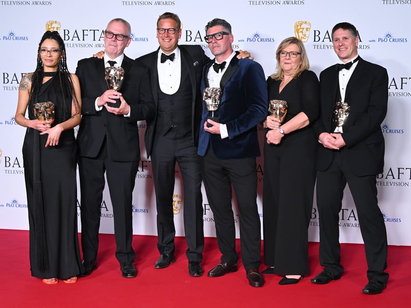From second left, Paul McNamara, Ed Chamberlin and production team pose in the Winners Room with the Sports Coverage Award for 'Cheltenham Festival Day One' during the 2024 BAFTA Television Awards.