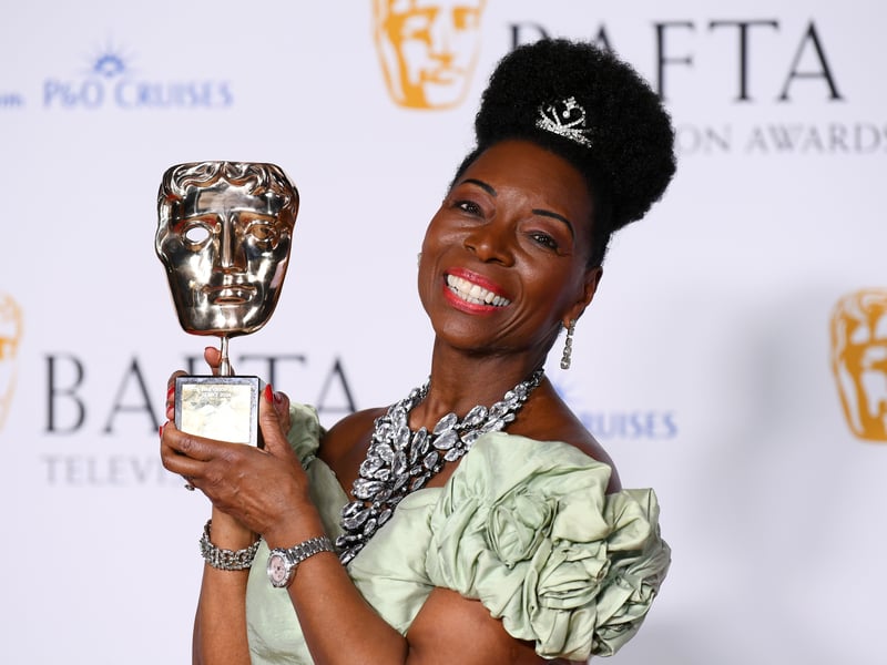 Baroness Floella Benjamin poses with the Fellowship Award in the Winners Room during the 2024 BAFTA Television Awards.