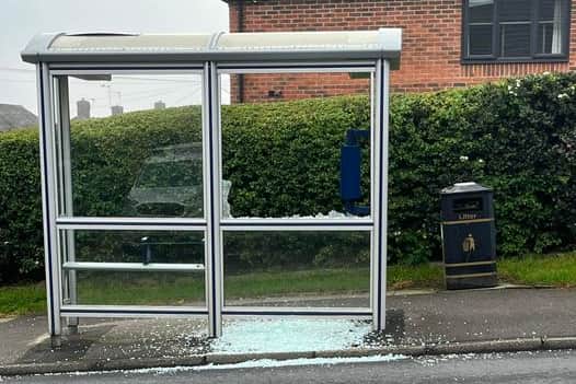 The smashed bus stop on Fox Lane.