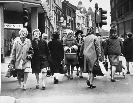 Shoppers make their way along Briggate in October 1967.