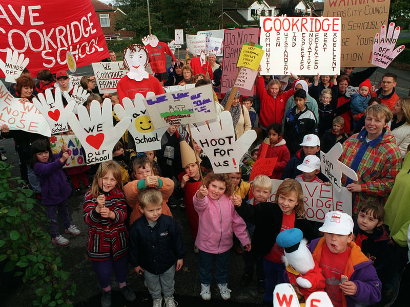 Parents and pupils hiold aloft homemade banners to showcase the strength of feeling over the closure plans.