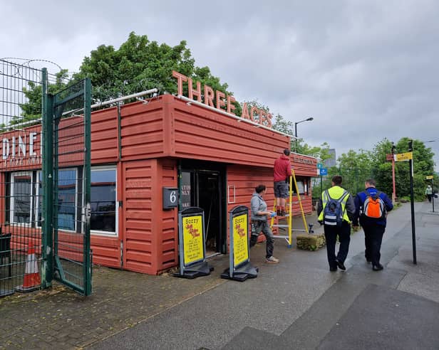 Workers are pictured transforming Hell's Kitchen Diner, on East Bank Road, Sheffield, for a starring role in a film. Picture: David Kessen, National World
