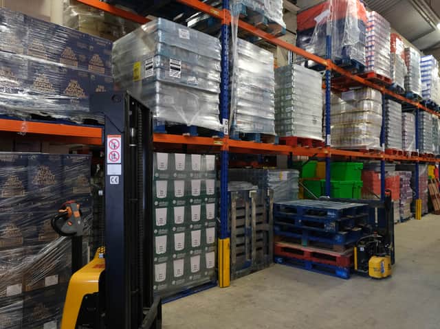 Shelving full of food reaches the ceiling of the S6 Foodbank's main warehouse on Cross Burgess Street in Sheffield.
