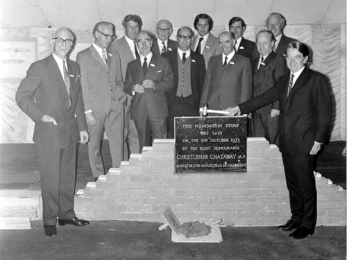 The Right Hon. Christopher Chattaway, MP then Minister for Industrial Development laying the foundation stone for Miers new factory in Cross Green. The directors of CW Pittard and co the parent company are standing behind the plaque Pictured in October 1973.